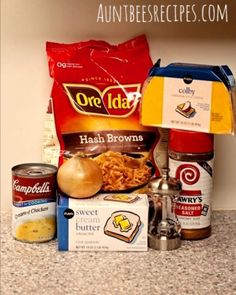 an assortment of food items sitting on top of a counter next to a bag of chips