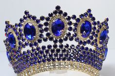 Beautiful sparkling tiara in gold color with royal blue stones Perfect for any occasion. It has a loop at the end of each side to attach it in your hair with bobby pins for added security. Approx. 4.25" tall Ships 1-2 business days. Royal Blue Tiara, Tiara Blue, Blue Tiara, Persian Jewelry, Hair With Bobby Pins, Quinceanera Tiaras, Gold Tiara, Blue Crown, Chula Vista