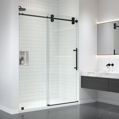 a bathroom with a walk in shower next to a sink and two mirrors on the wall