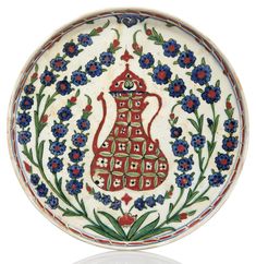 a decorative plate with flowers on it