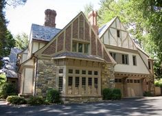 a large stone house with two story windows