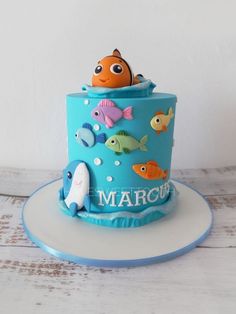 there is a blue cake with fish on it