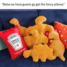 stuffed animals and pillows on a couch with the caption babe we have guests go get the fancy pillows?