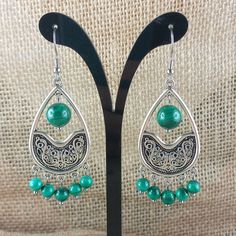 Unique model of boho style dangling earrings - arabesque with Malachite beads. Stainless steel ear hook. All earrings are handmade, in my workshop at home 😊. I do them with the heart and consciously ❤. I can also research which stone is right for you at the moment and make unique jewelry that relates to your energy. Whether you are simply sensitive to the beauty of natural stones, or a true fan of lithotherapy, you will find in my store a multiple choice of stones to wear as earrings, bracelets Bohemian Green Pierced Teardrop Earrings, Bohemian Green Teardrop Pierced Earrings, Bohemian Drop Danglers, Bohemian Green Chandelier Earrings For Festival, Bohemian Green Chandelier Earrings, Bohemian Teardrop Earrings With Dangling Beads As Gift, Bohemian Green Dangle Earrings, Bohemian Green Teardrop Earrings With Ear Wire, Bohemian Green Drop Earrings