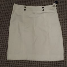 Sharp Looking, White Skirt. 4 Silver Button Accents The Waist. Side Zipper, Fully Lined. Hem Hits Right Around Knee Level. White Buttoned Mini Skirt For Work, White Mini Skirt With Buttons For Work, White Fitted Skirt With Button Closure, Fitted White Skirt With Button Closure, White Button Closure Mini Skirt For Work, White Mini Skirt With Button Closure For Work, White Skirt With Button Closure For Work, White Mini Skirt With Buttons, Women's Chaps