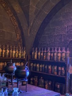 an old room with many bottles and jars on the shelves