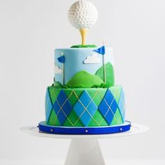 a cake with a golf theme on it and a flag sticking out of the top