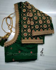 two green blouses with gold embroidery work on them