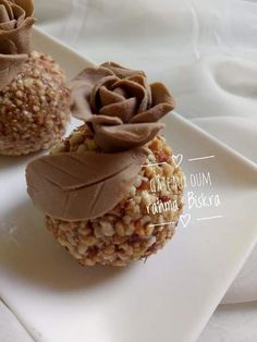 two desserts on a white plate with chocolate frosting