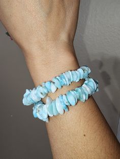 Beautiful & Natural Larimar Chip Bracelets. Great Quality Amazing blue color. Stretchable  Wrist Size: 6in & 6.25in **Please measure your wrist size & choose accordingly** ✨️The meaning of Larimar is clear communication and inner wisdom. Larimar combines the energy of the oceans with the energy of the heavens which means Larimar helps to combine our thoughts (air) with our emotions (water).  *DISCLAIMER: You will be getting item pictured. These are natural and genuine crystals and due to lighting effect and computer color, the actual color may vary depending on room lighting and sun light. We try our best to make listings as accurate as possible. Please make sure to check all pictures and videos.  *Gemstones are special and each one has their own unique vibration and properties. They requi Adjustable Larimar Round Bead Jewelry, Turquoise Larimar Natural Stone Bracelets, Adjustable Blue Larimar Jewelry, Turquoise Larimar Bracelets For Gifts, Turquoise Larimar Bracelets As A Gift, Adjustable Turquoise Larimar Beaded Bracelets, Handmade Adjustable Larimar Bracelets, Blue Larimar Hypoallergenic Jewelry, Inner Wisdom