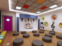 an empty room with lots of stools and musical instruments on the wall behind it