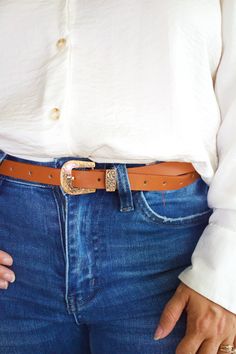 Elevate your style with our Var Buckle Belt! This versatile accessory features a unique var buckle that adds a touch of elegance to any outfit. Made from high-quality materials, it's not only fashionable but also durable. Upgrade your wardrobe and make a statement with our Var Buckle Belt. Trendy Gold Belts For Fall, Trendy Gold Belt For Fall, Trendy Gold Belt Buckles With Matching Belt, Chic Adjustable Belt With Gold Buckle, Trendy Belt Buckles For Fall, Trendy Belt With Gold Buckle For Work, Chic Brown Belt With Buckle Closure, Adjustable Belt With Buckle Closure For Fall, Trendy Fall Belt Buckles