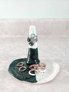 a ring holder with rings on top of it