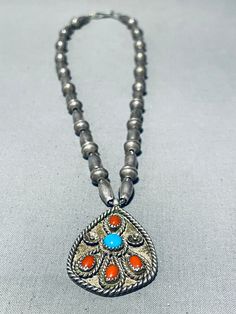 MAKE US AN OFFER BY CLICKING THE "MESSAGE SELLER" Button- This is a breathtaking vintage Navajo turquoise and coral silver necklace. This wonderful necklace contains a bottom large teardrop shaped silver pendant that includes 4 amazing coral stones with a center rounded Sleeping Beauty turquoise stone. Surrounding the stones are impressive silver works that consist of ropes and flowers. The bottom teardrop shaped silver pendant measures around 1-3/4" X 1-1/8". Resting throughout the rest of the Vintage Turquoise Necklace For Festivals, Vintage Concho Necklaces For Festivals, Vintage Concho Necklace For Festival, Traditional Turquoise Necklace With Concho, Traditional Silver Turquoise Necklace With Concho, Traditional Turquoise Concho Necklace, Traditional Silver Turquoise Concho Necklace, Western-style Turquoise Necklace With Large Pendant As Gift, Vintage Sterling Silver Turquoise Necklace, Nickel-free