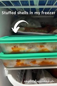 the freezer is filled with food and has two containers in it that are stacked on top of each other