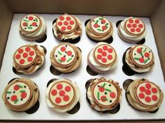 twelve cupcakes in a box decorated with cherries and pies on them