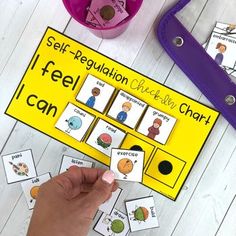 a person is playing with their self - regulation cards