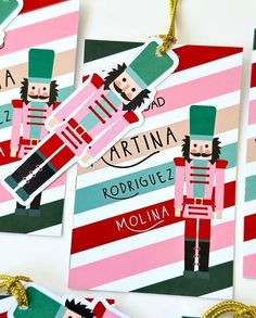 christmas ornaments made to look like the nutcrackers are hanging from strings on a wall