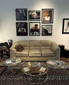 a living room filled with lots of furniture and pictures on the wall above it's coffee table