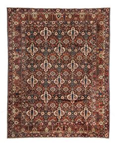 an antique persian rug with red and blue colors