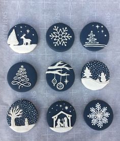 six decorated buttons with christmas scenes on them