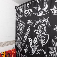 a black and white shower curtain in a bathroom