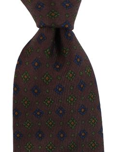 E. Marinella Ties | Wide Neckties E. Marinella Genuine E. Marinella tie, classic brown geometric design, fancy silk, hand made in Italy. Color: Brown Fabrics: 100% Silk, Self Tipped Size: Width: 3.15"/ 8cm, Regular Length 58" Origin: Hand Made in Italy Brand: E. Marinella Napoli Original E. Marinella Gift Box ( Flat ) Upon Request Genuine / Authentic Product code: mari220876 E. Marinella is a sartorial quality brand from Napoli, Italy. The E. Marinella tie designs are often classic geometric pri Classic Brown Neckwear With Ties, Brown Semi-formal Standard Tie, Classic Brown Ties For Office, Brown Standard Tie, Elegant Brown Tie, Fitted Brown Neckwear For Formal Occasions, Elegant Brown Suit And Tie Accessories For Office, Elegant Brown Silk Neckwear, Fitted Elegant Brown Neckwear