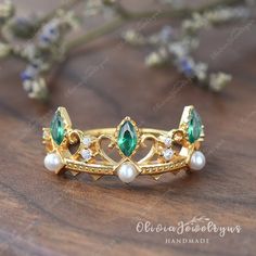 Vintage Marquise Emerald Pearl Ring Yellow Gold Crown Ring Antique Emerald Ring Real Diamond Engagement Ring Danity Bridal Promise Ring Gift ※Setting in Opal & Pearl: https://www.etsy.com/listing/1136820560/vintage-crown-ring-dainty-natural-opal ▶ Ring Details: ※Metal: 14K or 18K Solid Gold (Rose, White, or Yellow), Silver ※Stone Type: Lab Created Emerald, Pearl, and Natural Diamond ※Shape&Weight: Marquise Cut, Round Cut, approx0.45ct ※Band Width: approximately1.4mm ❤EXPLORE MY SHOP❤ https://www Unique Emerald Ring With Bezel Setting For Wedding, Wedding Emerald Open Ring With Bezel Setting, Fine Jewelry Crown-shaped Promise Ring, Fine Jewelry Crown-shaped For Anniversary, Crown Shaped Fine Jewelry For Anniversary, Anniversary Fine Jewelry Crown, Emerald And Pearl Engagement Ring, Pearl Ring Simple, Gold Crown Ring