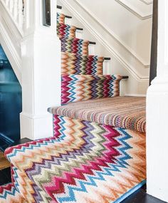 the carpet on the stairs is multicolored