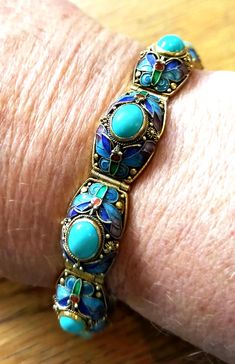 Hello and welcome to our shop - Justvintage22 We hope you find something you will love.  Description of the item Rare stamped Chinese silver enamel bracelet with turquoise-coloured stones & raised enamel panels. 7 1/8"  long X 1/2" Perfect enamel SJ601 These bracelets are now hard to find in this condition. The enameling is perfect in every way.  All items are vintage and inevitably have signs of age-related wear which we describe honestly and openly. About us We are based in Yorkshire, England, and have been selling vintage jewellery and collectibles online for the last 21 years.  We have a passion for vintage items and constantly seek out the unusual and interesting. We really look after all our customers whether big spenders or small. I believe in old-fashioned service and try and deliv Ann Taylor Enamel Bracelet, Luxury Filigree Enamel Jewelry, Luxury Vintage Jewelry With Enamel, Luxury Vintage Enamel Jewelry, Enamel Jewellery, Wedding Jewelry Bracelets, Enamel Bracelet, Yorkshire England, Silver Enamel