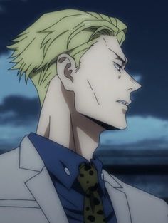 a man with blonde hair wearing a suit and tie looking off into the distance at night