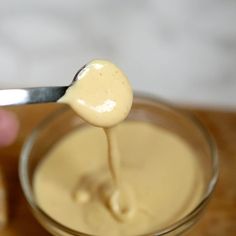 a spoon with some liquid in it on a table