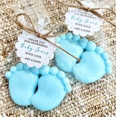 two blue baby feet shaped soaps tied with twine