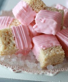 some pink marshmallows are on a plate