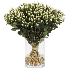 a vase filled with lots of white flowers