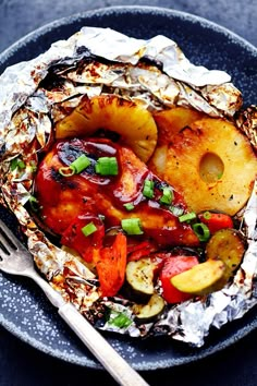 a close up of a plate of food with potatoes and other foods on it's side