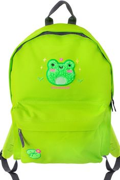 Look at his little face, and it's fluffy! Cutest frog ever and the lily pad embroidered detail is so adorable ♥️ This cute backpack is perfect for everyday use *MADE TO ORDER ITEM* Original Artwork designed, digitized, and embroidered by Momokakkoii  Features: Home Embroidered in the UK Perfect for School Premium heavyweight fabric Colour: Lime Green Dimensions: 42 x 31 x 21cm Capacity: 18 Litres Zippered front pocket Grab handle Padded back panel Padded adjustable shoulder straps.  600D Polyest Cute Green Backpack For Students, Cute Green Student Backpack, Green Kawaii Backpack, Cute Green Backpack For Back To School, Embroidered Backpack, Frog Decor, Cute Backpack, Fabric Colour, Backpack School