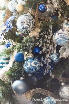 a christmas tree with blue and silver ornaments