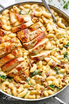 chicken and pasta with parmesan cheese in a skillet