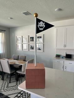 a table with chairs and a flag on it in the middle of a living room