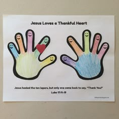 a poster with two hands painted in different colors and saying jesus loves a thinkful heart