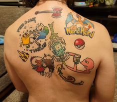 the back of a woman's shoulder with tattoos on it