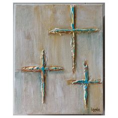 three crosses are painted on a canvas