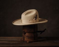 Now shipping. We are only making four dozens, so there is a good chance we will run out. If your size is not available, subscribe to our mailing list and we will let you know when the next run is released in May. A classic Western hat with some flourish. The pictures speak for themselves and here are the specs: buckskin color (light tan); 4 1/4" gentle Gus crown; 5 3/4" brim, bound, rolled edge; a 12-ligne bone grosgrain ribbon band; the highest quality hand-reeded leather sweatband; and our own Greeley Hat Works, Borsalino Hats, Mens Dress Hats, Making Hats, Western Hat, Unique Hats, Western Hats, Run Out, Cool Hats