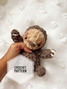 a hand holding a small stuffed animal in it's left hand with the text crochet pattern below