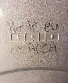 some writing on the side of a car door with two switches and one light switch