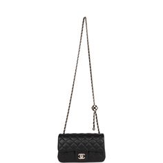 This Pearl Crush Mini Rectangular flap bag is of black lambskin with light gold tone hardware and has a front flap with signature CC turnlock closure, rear half moon pocket, single interwoven black leather and light gold tone chain link shoulder/crossbody strap with adjustable "pearl" ball. The interior is lined in gold leather and features a zipper pocket with Chanel pull and an open pocket below. Collection: 23C Origin: Italy Condition: Pristine; new or never Accompanied by: Chanel box, Chanel dustbag, carebook, felt and retail UPC Measurements: 8" width x 5" height x 2.5" depth; 22.5" strap drop Chanel Pearl Crush, Chanel Pearl, Chanel Box, Chanel Pearls, Diaper Backpack, Gold Leather, Flap Bag, Half Moon, Crossbody Strap