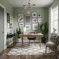 a home office with green walls and pictures on the wall above it, along with a chair