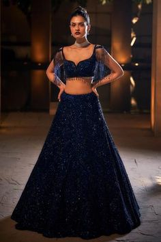 Navy lehenga with all-over sequin and crystal embroidery. Comes with cutout shoulder blouse enhanced with waterfall bead tassels.
Component: 2
Embellished
Neckline: V Neck
Sleeve Length: Sleeveless
Color: Blue
Plunging neck
Bead tassels
Cutout shoulder straps
Tassel tie-up back - Aza Fashions Crystal Lehenga, Sequin Lehenga, Seema Gujral, Sangeet Outfit, Reception Lehenga, Crystal Embroidery, Blue Lehenga, Bride Sister, Embellished Blouse