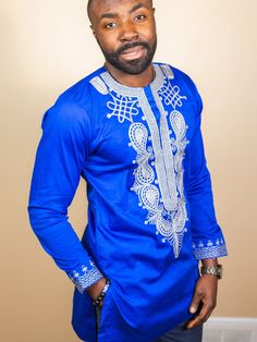 Royal Blue with Gold and white embroidered tunic shirt Long  sleeve length 100% cotton Men's Tailored Shirt made with very Quality Cotton Fabric. Ready To Ship CARE INSTRUCTIONS:  Dry Clean Recommended DO NOT BLEACH Press with warm iron  ALL SALES ARE FINAL Exotic Men, African Maxi Skirt, African Shirt, African Wear Styles For Men, African Attire For Men, Style Africain, African Shirts For Men, Mens Dress Shirts, African Shirts